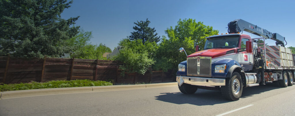 Red, White and Blue L&W Supply Truck on the Highway