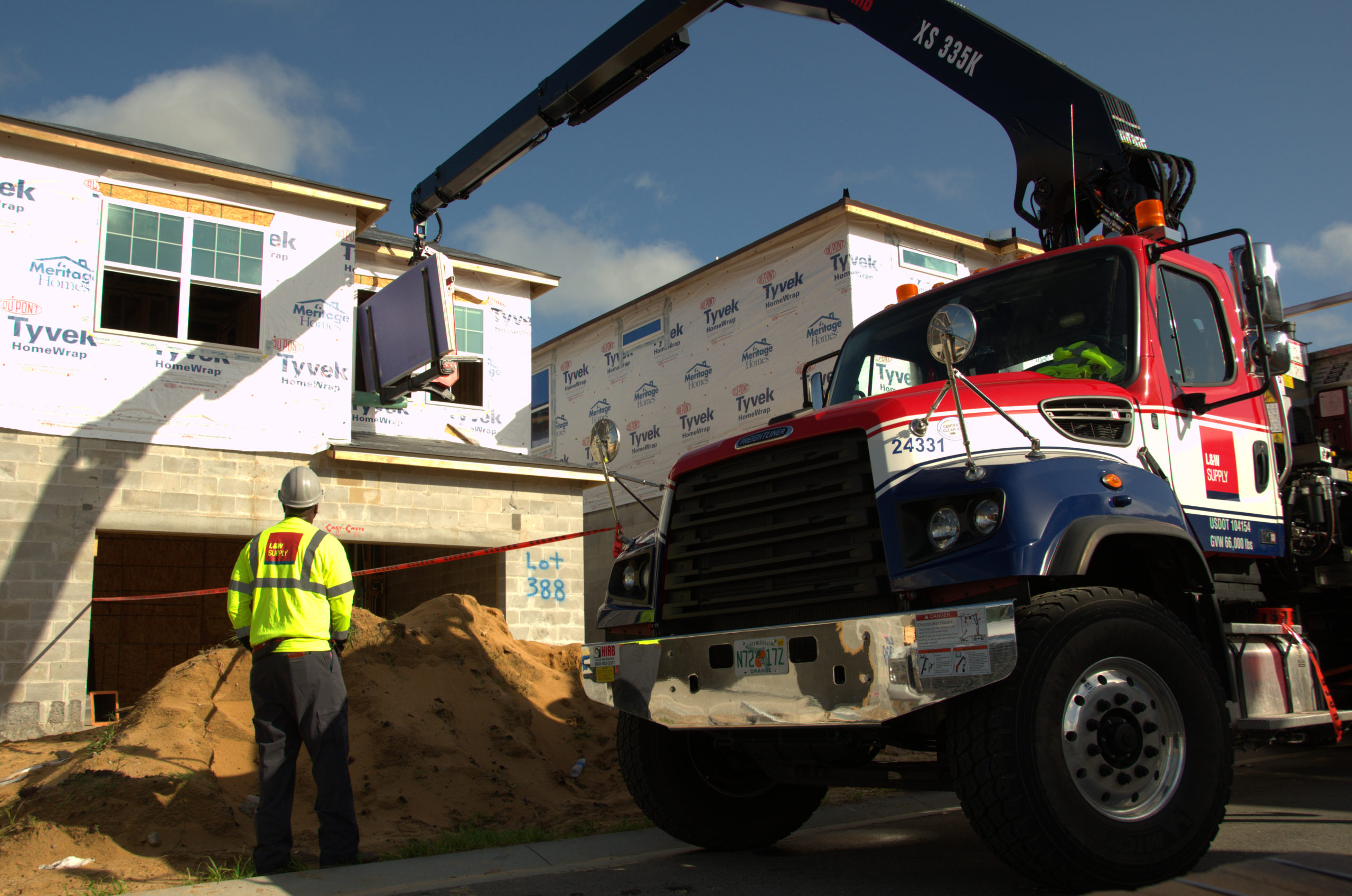 An L&W Supply Truck Making A Delivery To A Jobsite