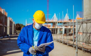 A builder using corona practices whilst working on a new build site